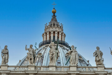 Fototapeta na wymiar The Dome of the Basilica of San Pietro in Vatican City with blue sky