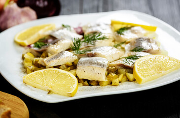 sandwiches with herring, onion and cucumber
