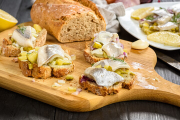 sandwiches with herring, onion and cucumber