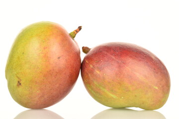 ripe organic mangoes, close-up, on a white background.