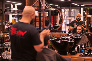 Brutal barber shaves a man in a barbershop