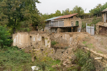 Fototapeta na wymiar Semi destroyed houses in the town of Hadrut part of the Janapar Trail in Nagorno Karabakh in the Republic of Artsakh