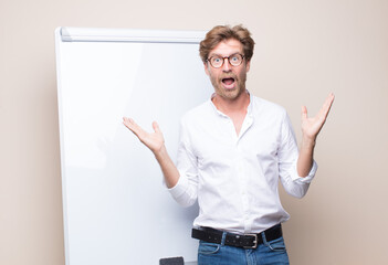 adult blonde businessman with a board