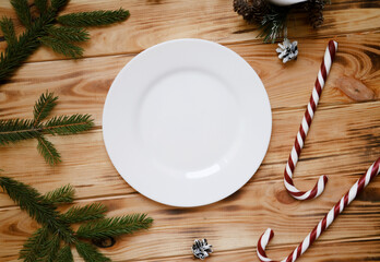 White plate Christmas mock up, New Year decorations, candles and tree