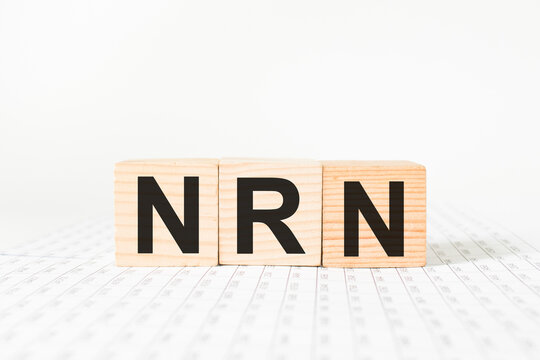 word NRN on wooden blocks, white background, business concept. business and Finance