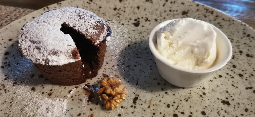 Chocolate fudge with vanilla ice cream and walnuts