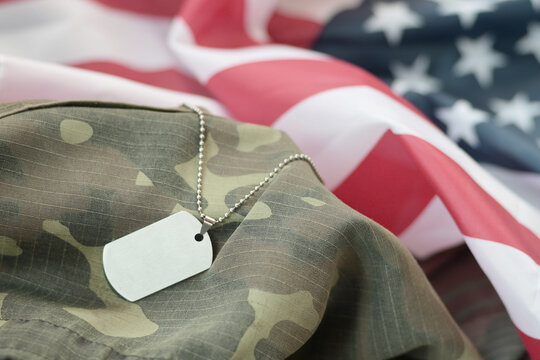 Silvery Military Beads With Dog Tag On United States Fabric Flag And Camouflage Uniform