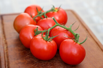 Tomatoes on wooden board