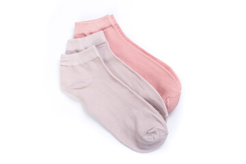 two pairs of colored short socks on a white background, top view