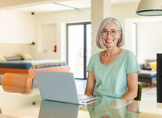 middle age woman looking goofy and funny with a silly cross-eyed expression, joking and fooling...