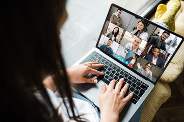 Online business meeting. Business team working from home in a video conference. .The girl...