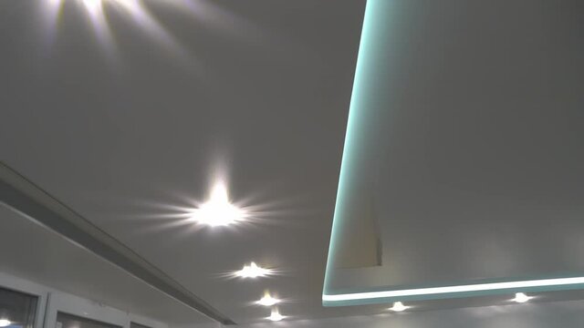 suspended ceilings and plasterboard structures in the decoration of an apartment or house. Dolly video. Led lighting.
