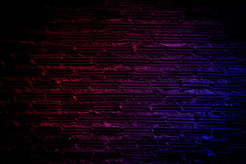 Neon light on brick walls that are not plastered background and texture. Lighting effect red and blue neon background vertical of empty brick basement wall.