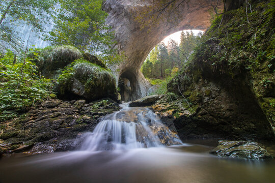Composition of skull shaped rock and waterfall