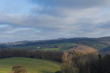 Beautiful landscape view hilly countryside fields with trees and forests