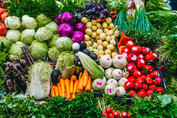 Fresh vegetables background, herbs and fruits on the counter of the vegetable market