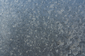 Frozen window glass covered with frost