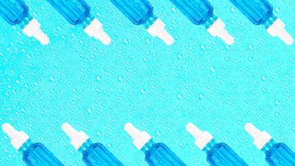 Moisturizing serum in glass bottle with white pipette on blue background with drops. Hyaluronic acid for hydration. Cosmetics pattern. Products for makeup and skin care. Banner. Place text. Copy space