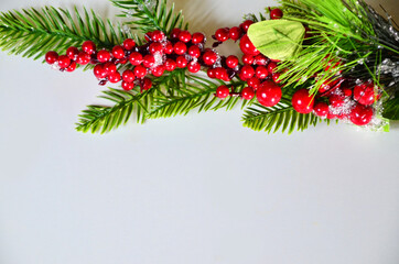 Christmas Tree decoration christmas tree branch, red berries, top view, copy space, new year or christmas holidays