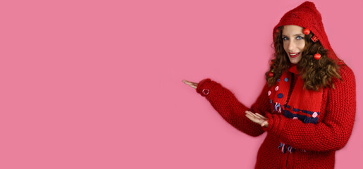 Beautiful girl with christmas toys in hair on red background. Horizontal banner