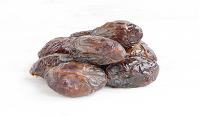 Sweet dried dates on a white background