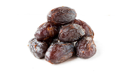Heap of fresh dates on white isolated background