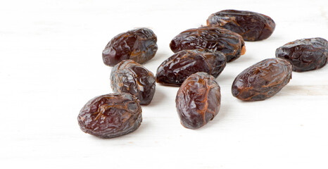 Heap of large sweet dried dates scattered