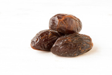 Three dates organic soft and fresh on isolated background
