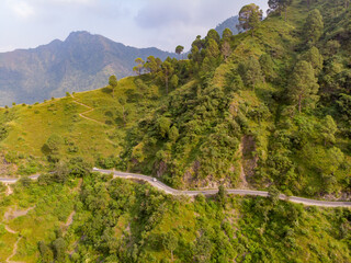 Aerial view of a road through the mountains. Taken through a drone in the himalayas.