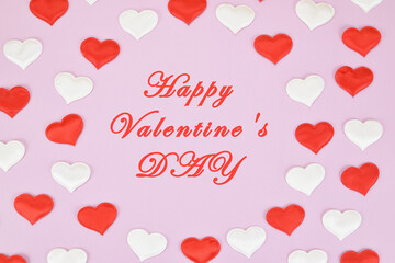 Red and white hearts on a pink background around the congratulation to everyone in love