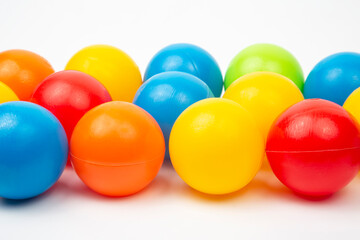 Colored plastic balls on white background. leisure and game items. round objects