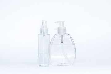 Fighting Coronavirus concept. Hand sanitizer isolated on a white background. Selective focus, copy space and close up. Prevent COVID-19 virus infection and spread.