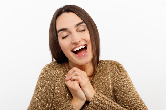 Cheerful happy young beautiful girl looking at camera smiling laughing over white background.