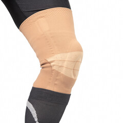bandage for fixing the injured knee of the human leg on a white background. medicine and sports. limb injury treatment