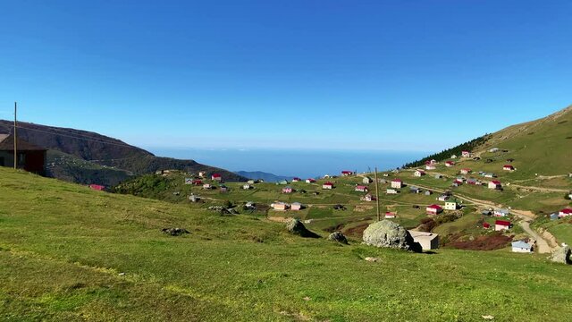 Footage of mountain village (high plateau) called "Sis Dagi" of Trabzon city of Black sea region in Turkey. Beautiful nature scene in sunny day. Camera moves forward.
