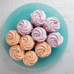 a plate full of colorful marshmallows, dessert on the table, a lot of sweets, general plan, trend colors,