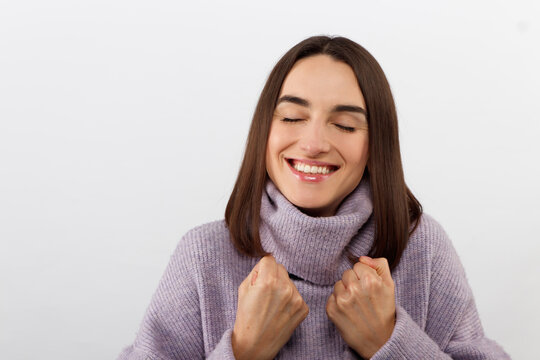 Close-up alluring happy smiling brunette woman in a purple sweater looking forward to exciting event, grinning joyfully express positivity and enthusiasm, glad take part interesting promo campaign