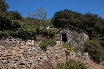 traditional stone house with terrace cultivation on Ikaria island in Greece