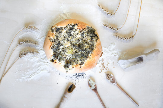 Flat lay composition of ingredients: flour, onion, wheat, onion flatbread at The regional Museum of Cebularz in Lublin, Poland - living museum