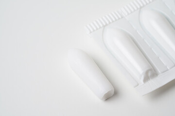 Suppositories for anal or vaginal use on a white background medication.