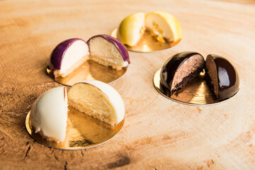 Mousse cakes on a wooden table