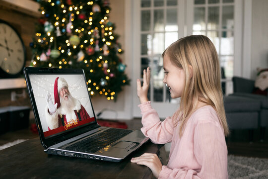 Girl And Santa Wave To Each Other During Video Chat