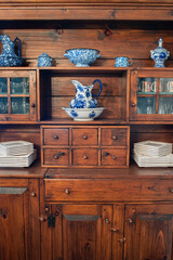 country cupboard with blue and white dinnerware