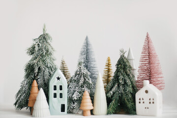 Merry Christmas! Christmas scene, miniature holiday village. Christmas little houses and trees