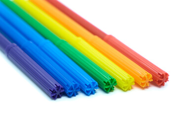 Colored felt-tip pens isolated on white background. Close-up colored markers on white. Drawing concept.