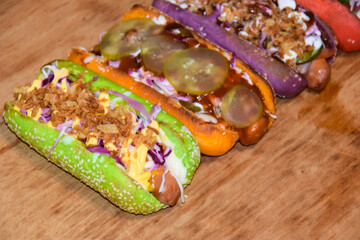 hot dogs assorted multi-colored buns different toppings