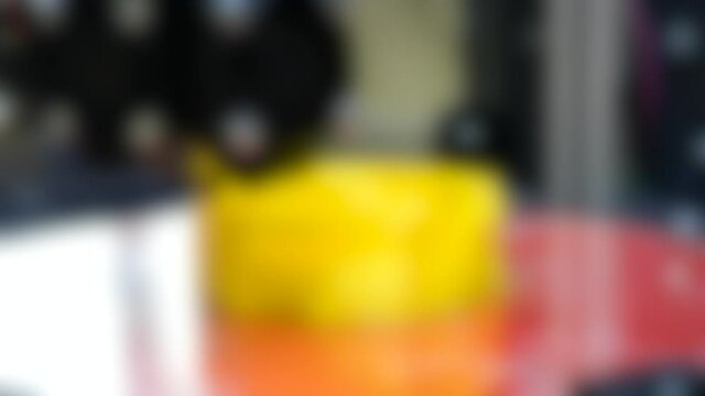 Blurred background. 3d printing printer bright yellow model close-up.