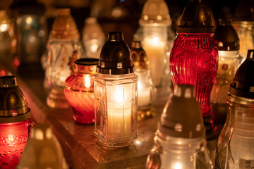 Candles on the grave. Cemetery.