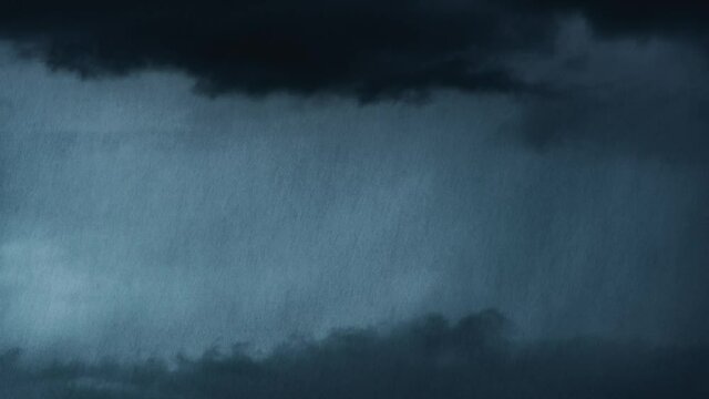 Storm with heavy rain and dark black clouds. Timelapse of a storm. 4k stock video footage. Rainfall. Rainy day. Dramatic nature.