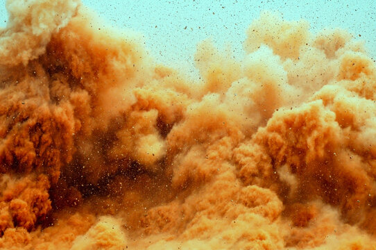 Close up of dust storm after dynamite blast in the middle east